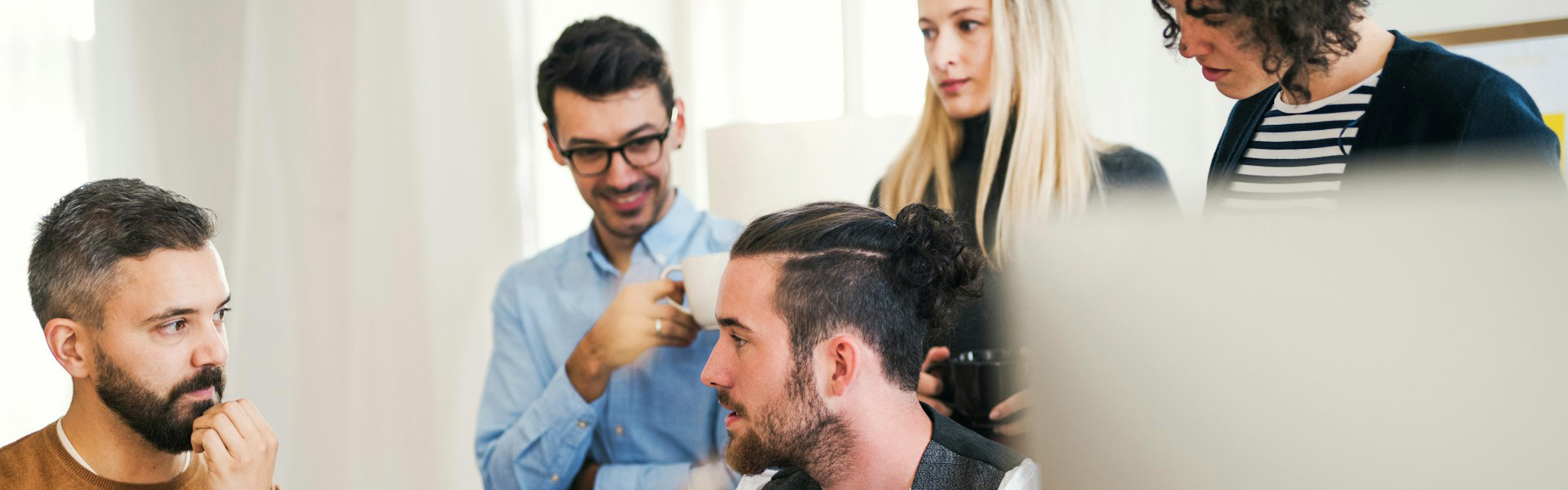 A group of healthcare consultants discussing practice optimization strategy for a medical practice